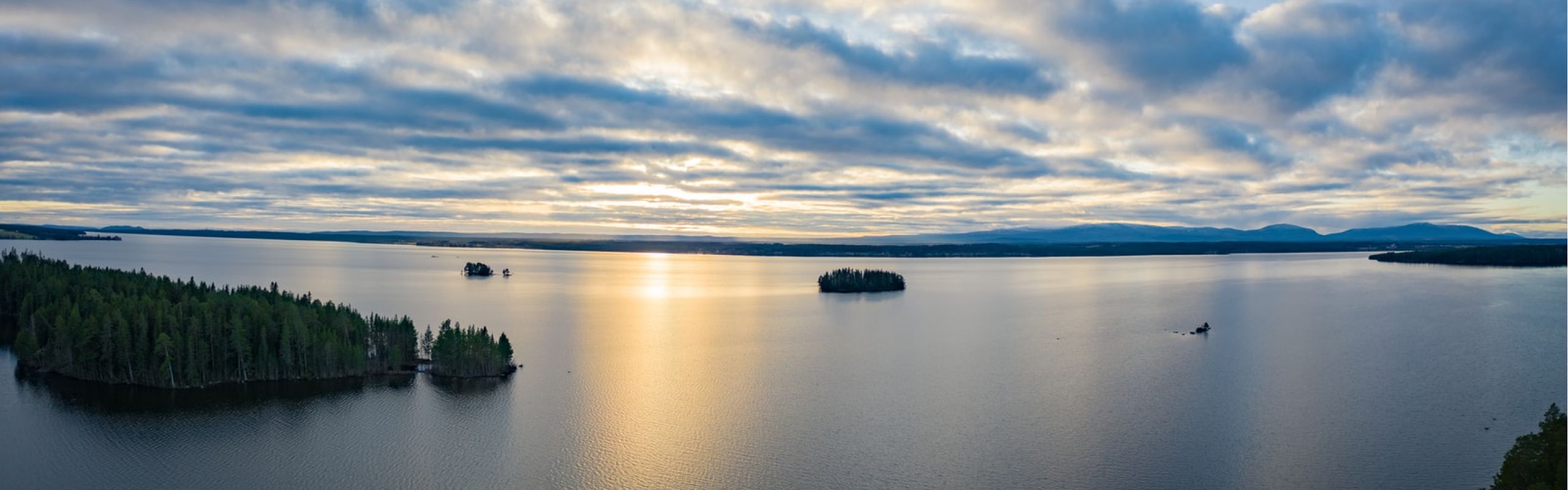 calm sea under white clouds during daytime