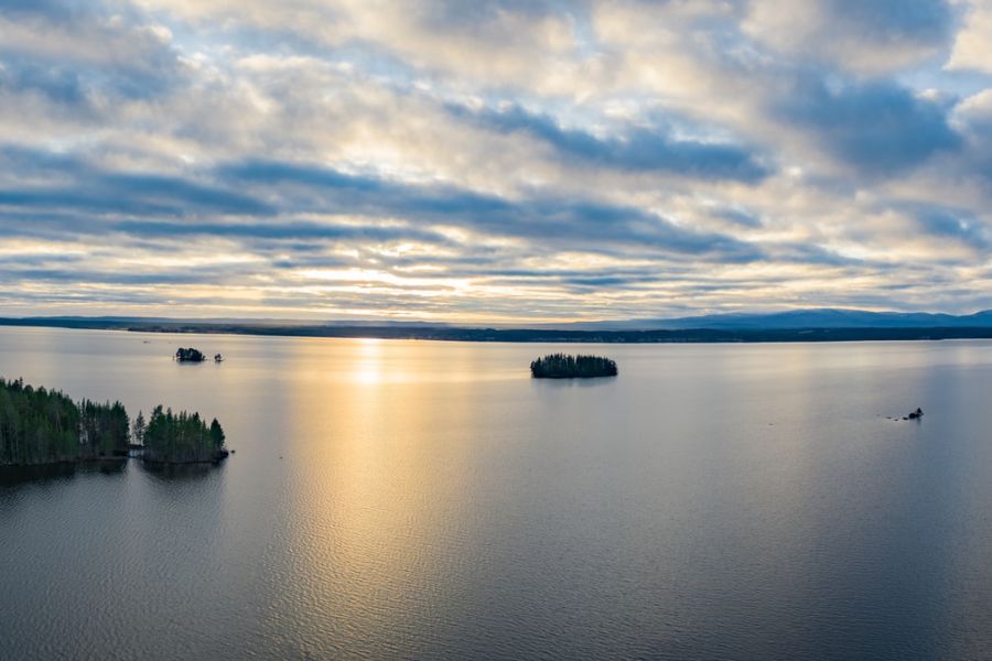 calm sea under white clouds during daytime